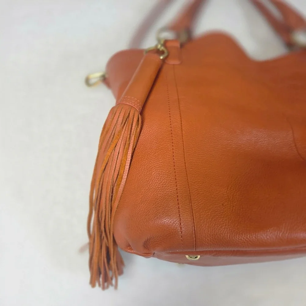 Burnt Orange Pebbled Leather Hobo Bag with Tassel and Shoulder Strap Womens